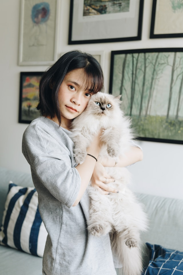 person holding a cat